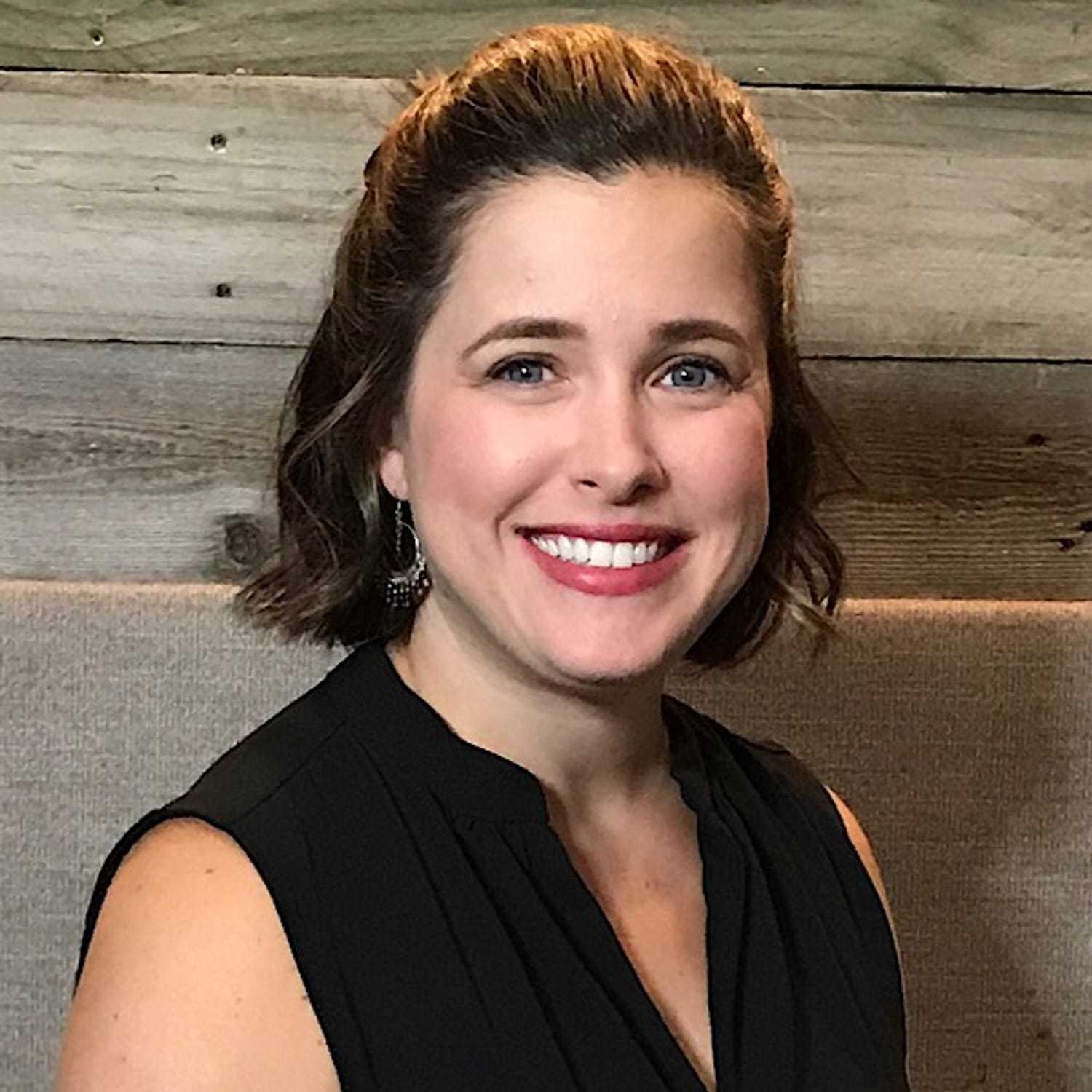 Portrait of Elizabeth, a professional stylist at ARIA Salon, showcasing their expertise and style.