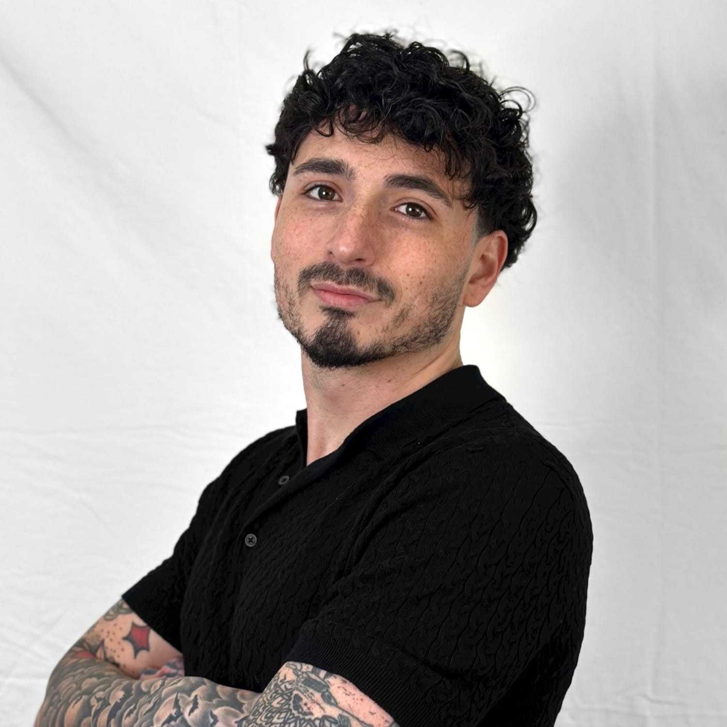 Portrait of Armon, a professional stylist at ARIA Salon, showcasing their expertise and style.