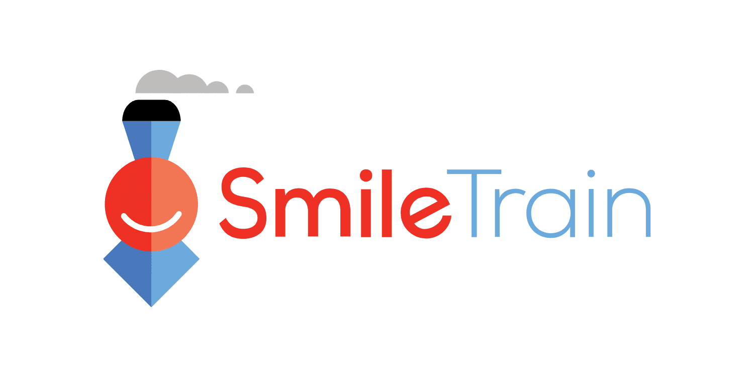 Smile Train logo featuring a smiling red face and blue train icon.